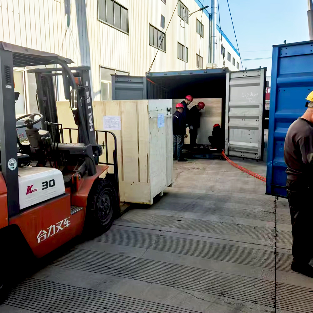 Electrical equipment being loaded into an export container